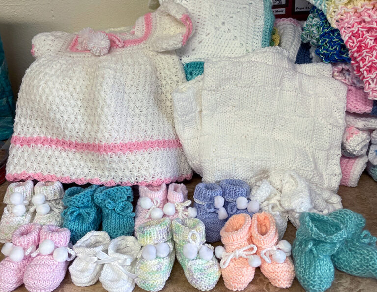 Christ Child Society of Pasadena with finished Layette sets