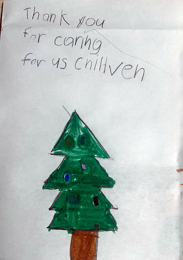 Thank you letter with a Christmas Tree drawn on it from one of the kids who received Christmas gift cards from the Christ Child Society of Pasadena