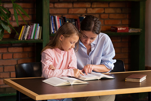 Members of Christ Child Society of Pasadena volunteer to help kids learn to read at local Parish schools